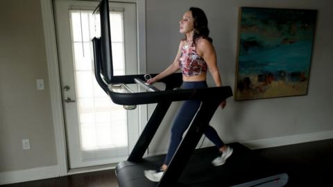 Woman on Peloton treadmill