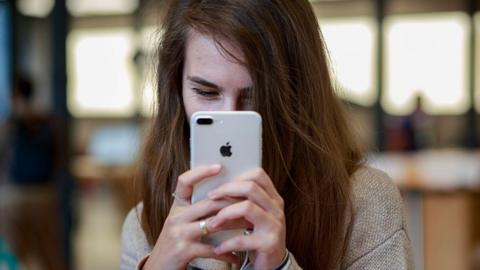 Girl takes selfie with iPhone