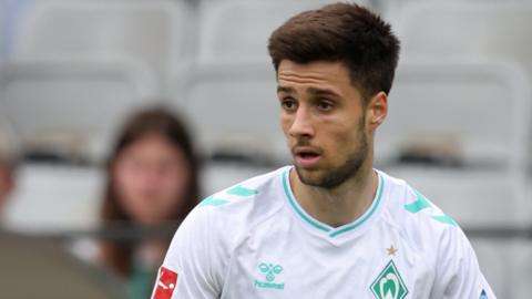 Ilia Gruev looks for a pass during a Werder pre-season game