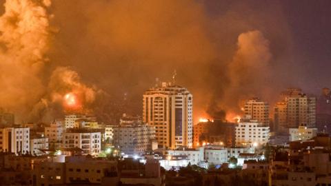 Flames and smoke billow during Israeli strikes in Gaza