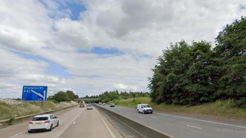 Generic view of the M54 in Shropshire near Junction 3 with a blue motorway sign directing drivers to the A41 towards Wolverhampton