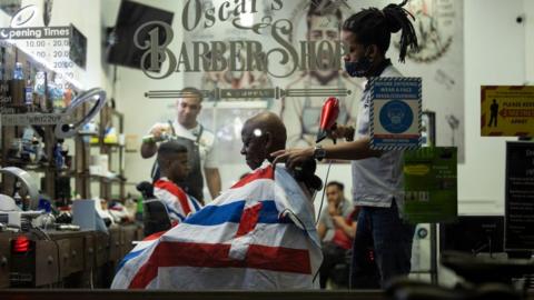 A man has his hair cut at Oscar's Barber Shop on Walworth Road on November 02, 2020 in London