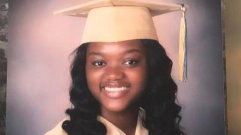 Ms Roberson in her high school graduation cap and gown, in a photo sourced from Facebook