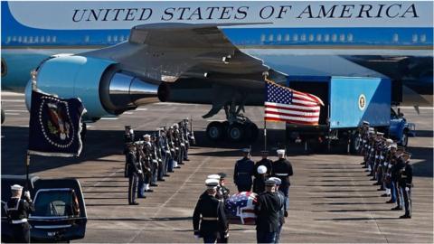 The 41st president's body is being flown from Texas to Washington on board Air Force One.