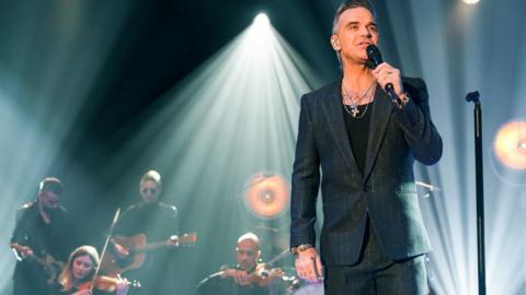 Robbie Williams appearing on Graham Norton's chat show