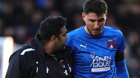 Dan Happe (right) with a member of Leyton Orient's medical team