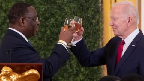 US President Joe Biden (R) and President of Senegal Macky Sall (L) offer toasts at the US-Africa Leaders Summit dinner in the East Room of the White House in Washington, DC, USA, 14 December 2022.