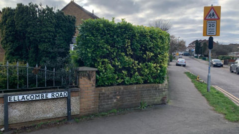 A road sign for Ellacombe Road