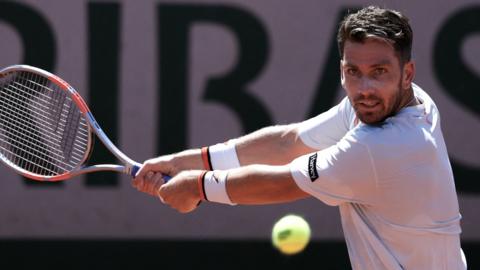 Cameron Norrie hits a backhand