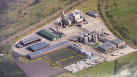 An artist's impression of what the specialist waste treatment plant would look like. There are a number of warehouses and a small car park next to metal cylinder containers.