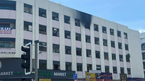 Smoke marks caused by a fire are seen on the exterior of a building in Dubai, United Arab Emirates