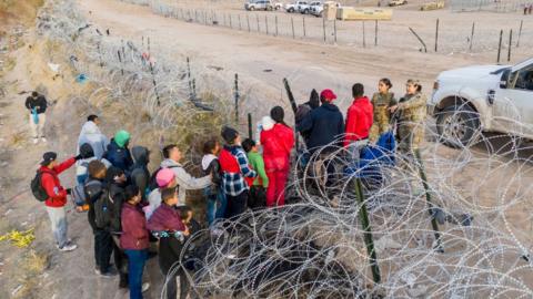 Migrants cross from El Ciudad Juarez, Mexico into El Paso, Texas