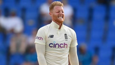 Ben Stokes grimacing after bowling a ball against West Indies