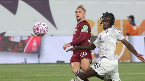 West Ham skipper Jarrod Bowen watches as his shot heads towards the goal against Manchester United