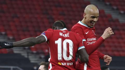 Fabinho (right) celebrates with Sadio Mane