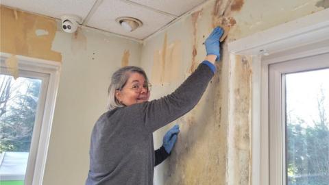 A person redecorates a room