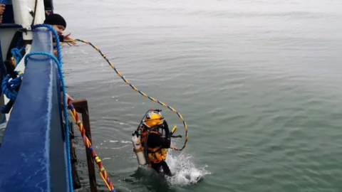 A Navy diver taking part in the recovery operation off Hook Head