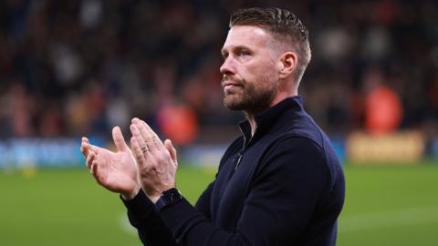 Luton manager Rob Edwards applauds supporters