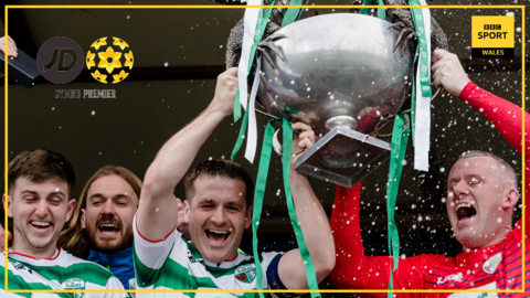 TNS players celebrate with the Cymru Premier trophy