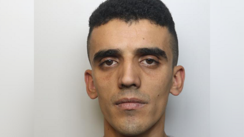 A police mugshot of Ervis Hasanaj