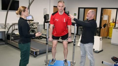 Professor Liam Kilduff and Dr Camilla Knight testing an athlete's core strength