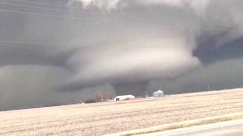 An eyewitness has captured two tornadoes from their car in Keota, Iowa.