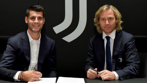 Alvaro Morata signs alongside Pavel Nedved