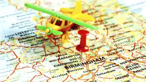 Map with toy plane showing Birmingham and the West Midlands