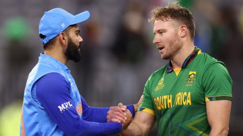 India's Virat Kohli (left) and South Africa's batter David Miller (right) shake hands