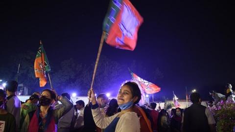 BJP supporters in a celebratory mood after counting for the Bihar assembly election showed leads for the NDA, at the party headquarters on November 10, 2020 in New Delhi, India.