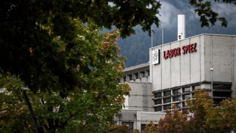 The Spiez Laboratory is seen through the trees in this photo