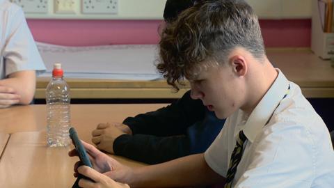 Pupils looking at iPad