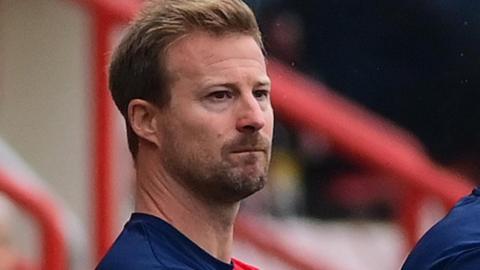 Wade Elliott looks on from the touchline as Cheltenham were beaten by Exeter