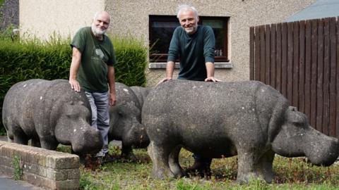 Stan and Mark Bonnar in Glenrothes with concrete hippos made by Stan in the 1970s Stan and Mark Bonnar in Glenrothes with concrete hippos made by Stan in the 1970s