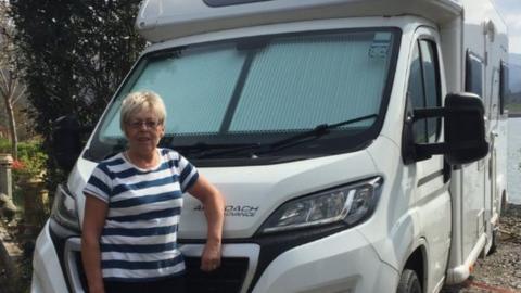 Ingrid Anderson beside the motorhome she bought from Motorhome Hire Scotland