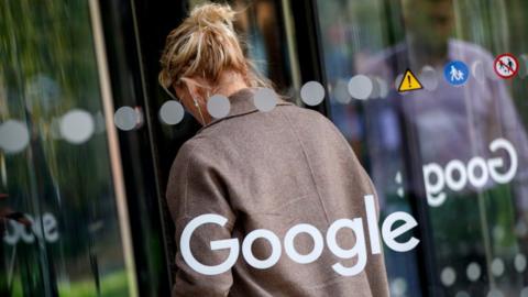 A woman walks into a Google office