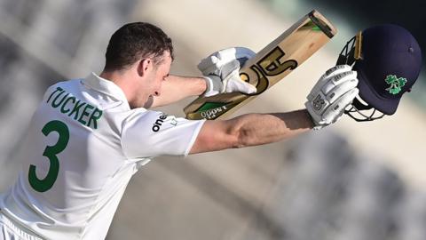 Ireland's Lorcan Tucker celebrates after scoring a century during the third day of the Test cricket match between Bangladesh and Ireland