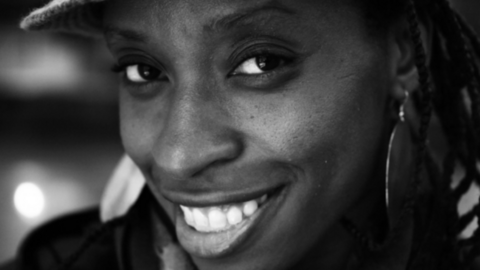 Black-and-white candid of Irenosen Okojie