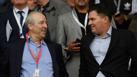 Steve Kaplan and Jason Levien at a Swansea game 