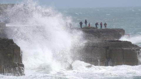 Waves crashing against the shore in Portland, Dorset