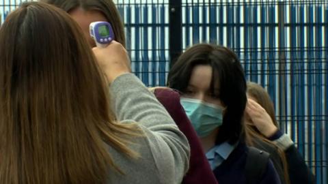 Pupils at Mercy College in Belfast having their temperature taken on their return to school