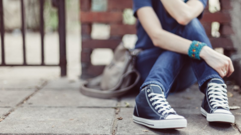 Girl sitting on the ground