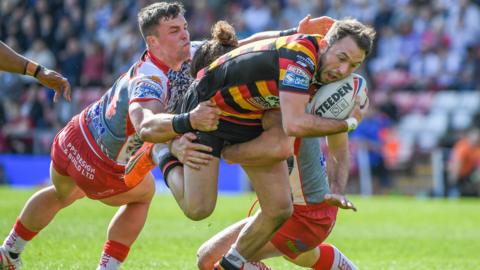 Ryan Brierley tries to find a gap for Salford as Leigh's Kai O'Donnell attempts a tackle