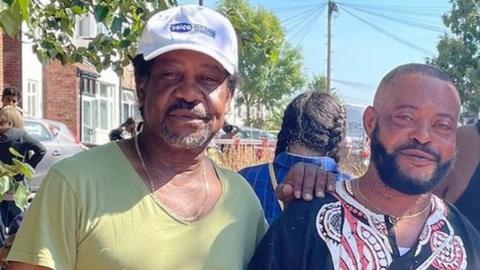 Residents Delroy Simms, 62, (left) and Kutoya Kukanda, 50,