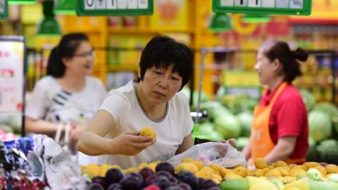 People purchase at a super market on June 9, 2018 in Fuyang, Anhui Province of China.