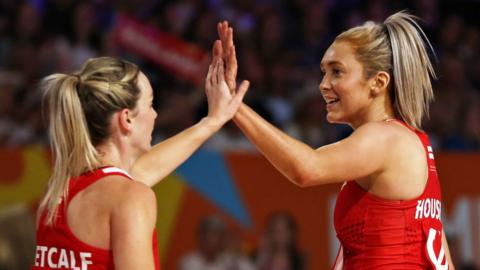 Natalie Metcalf and Helen Housby high five