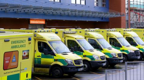 A line of ambulances waiting outside A&E at a hospital