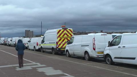 White vans parked on New Brighton promenade