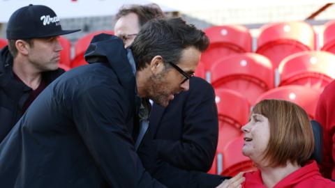 Kerry Evans (right) with Ryan Reynolds and Rob Mc Elhenney