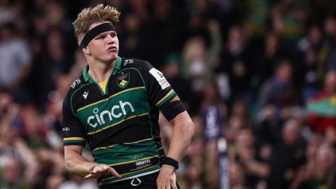 Northampton's Henry Pollock tries to calm the crowd